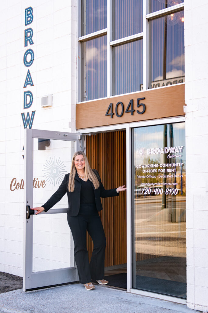 Anne Gillaspie, Denver brand strategist and founder of Fix & Form, standing at the entrance of the Broadway Collective office building and welcoming clients.