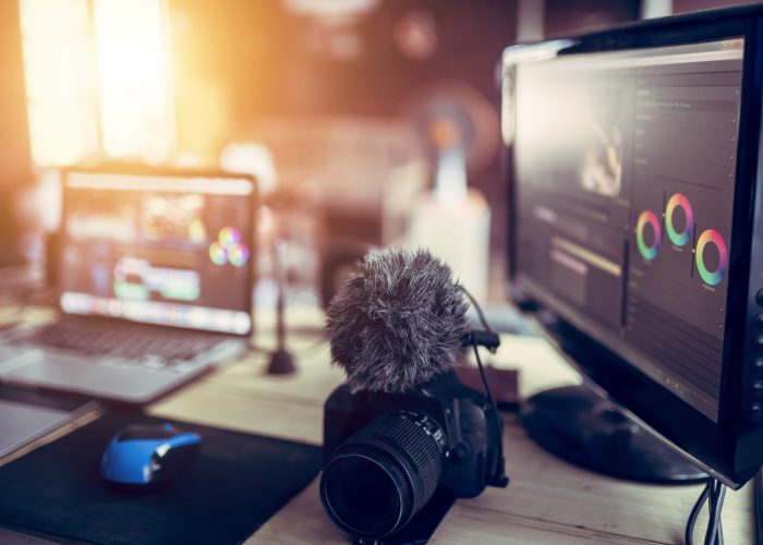 Freelance desk and laptop for editing footage is job for content upload to internet.