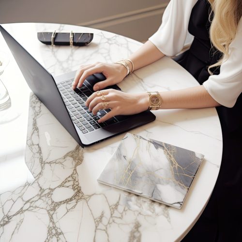 a woman working with her laptop at the table